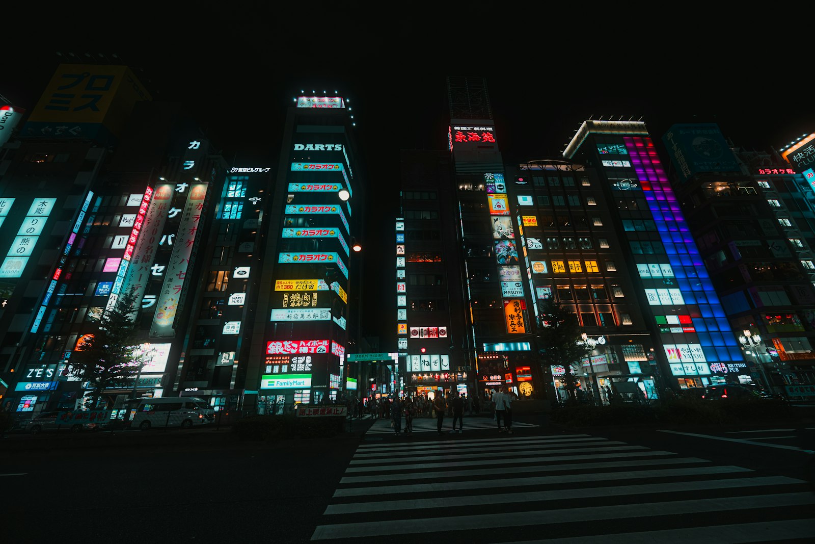 Neon-lit Kabukicho street at night, a short walk from a capsule hotel near Shinjuku nightlife