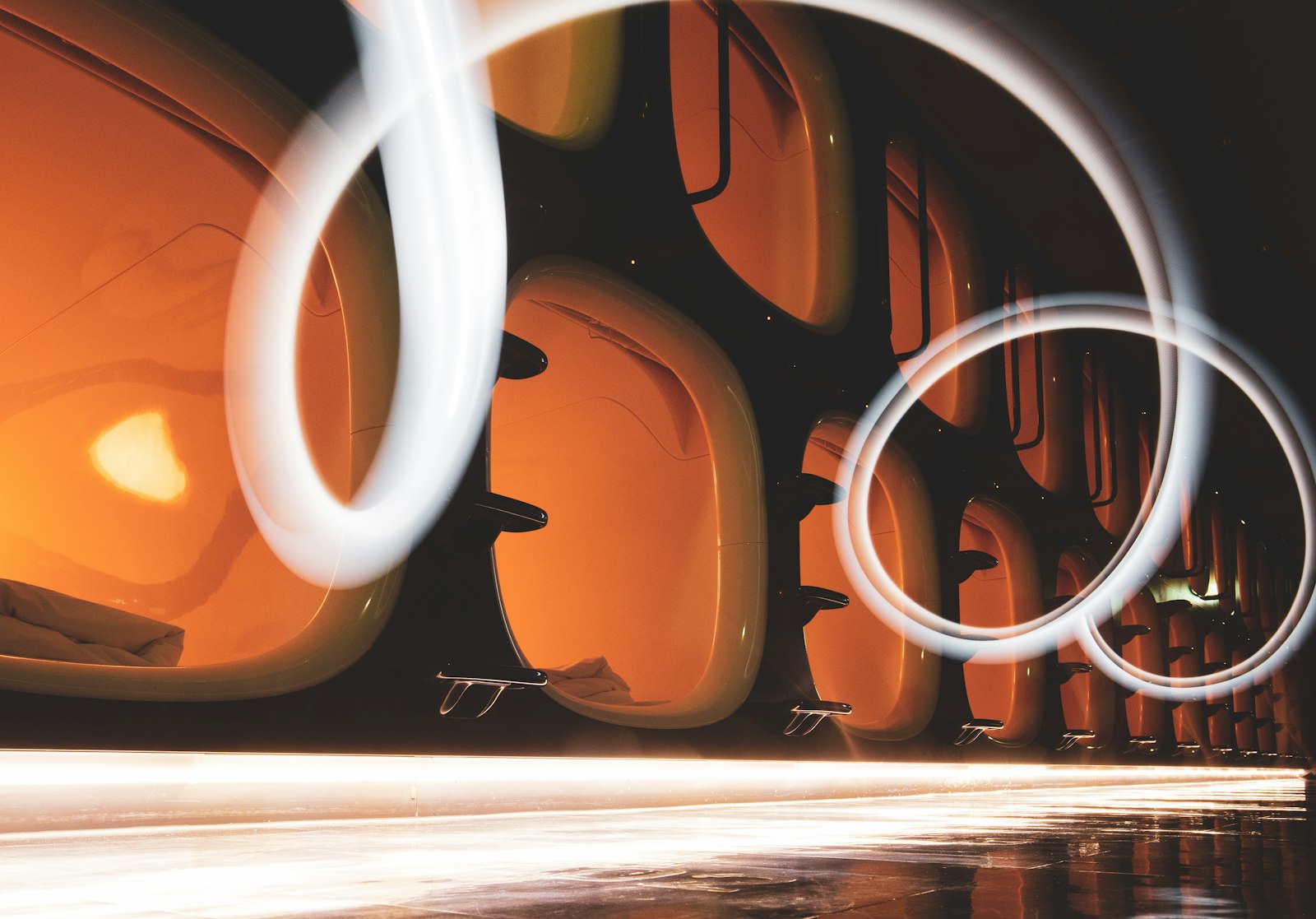 Row of sleeping pods inside a Shinjuku capsule hotel