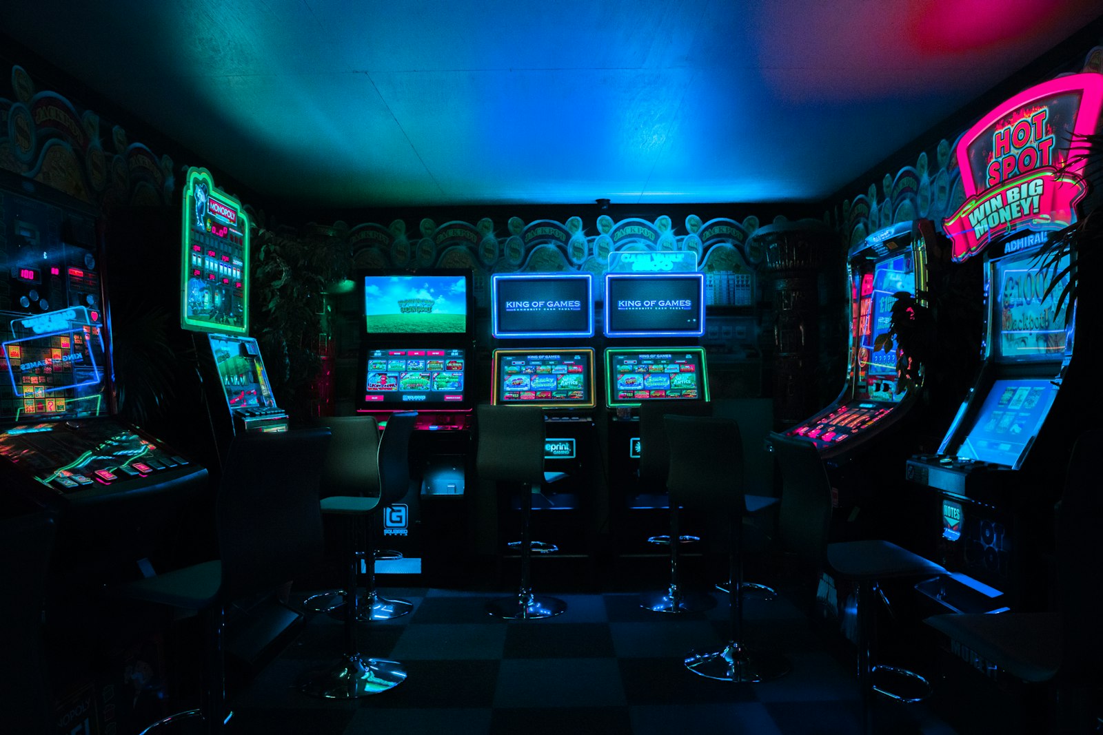Retro arcade cabinets glowing at night, the atmosphere of a gaming bar in Tokyo