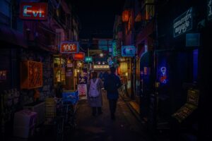 Neon signs above a Kabukicho street where many girls bars are located