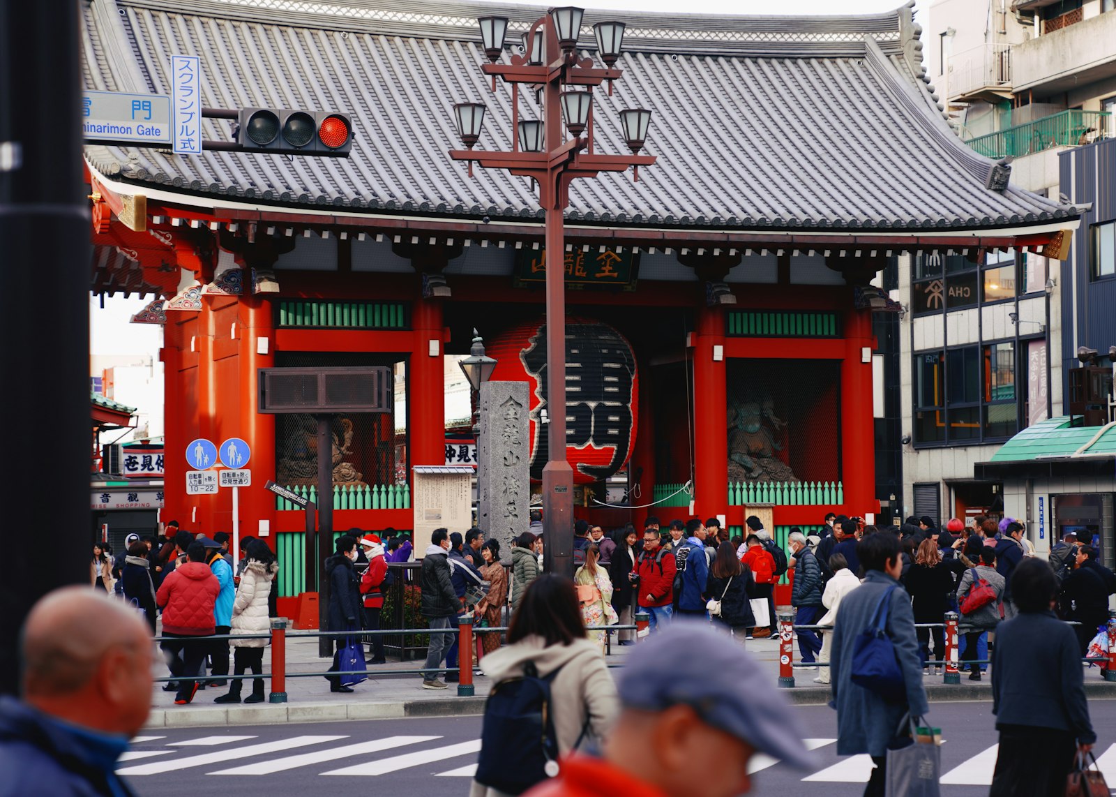 Kabukicho Ichiban-gai gate at night with crowds heading into Shinjuku's nightlife district