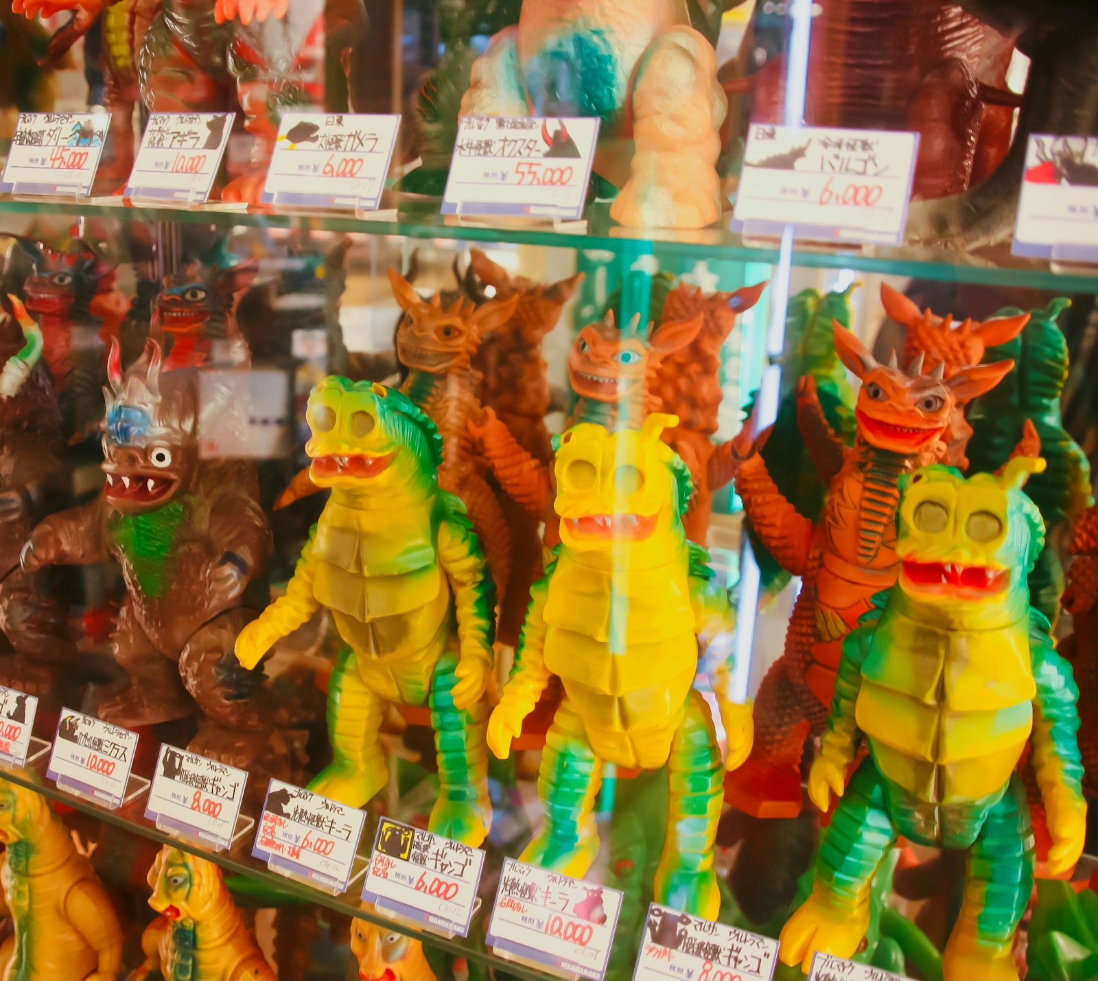 Shelves of kaiju monster figures, a theme you'll find in Nakano's subculture bars