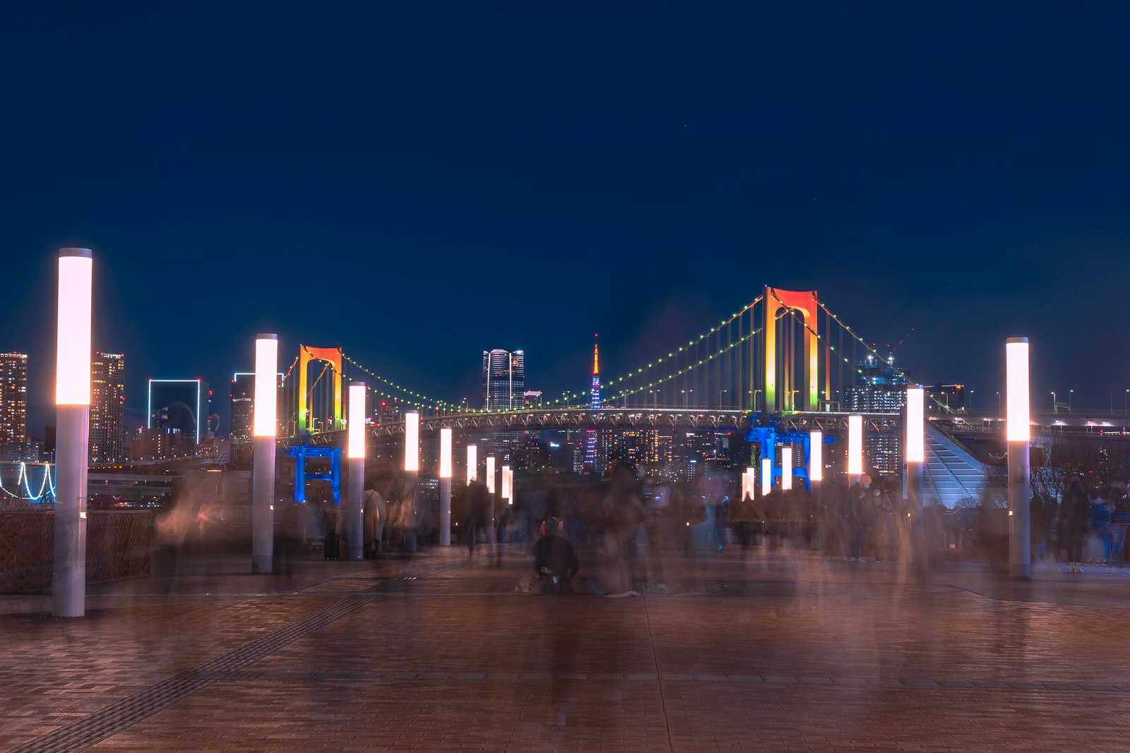Illuminated fountain show at night on Tokyo Bay, part of the Odaiba night view near Rainbow Bridge