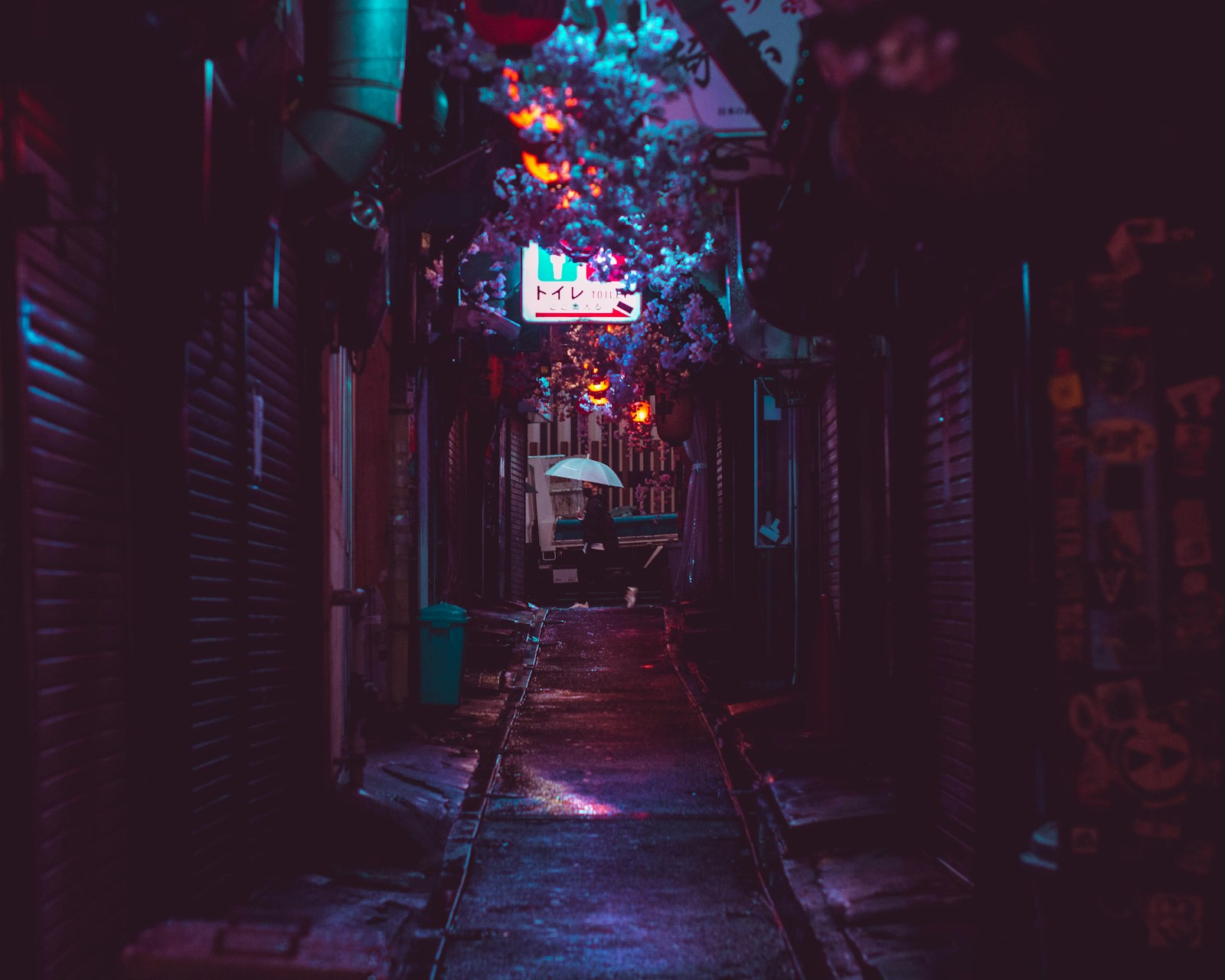 Roppongi street at night with neon signs, the heart of Tokyo's foreigner-friendly club district