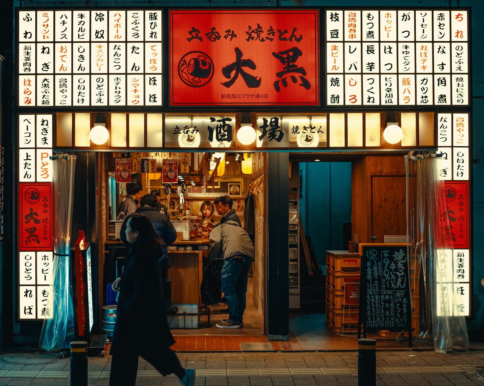 English cover charge sign on a Golden Gai bar door, a sign the bar welcomes foreign tourists