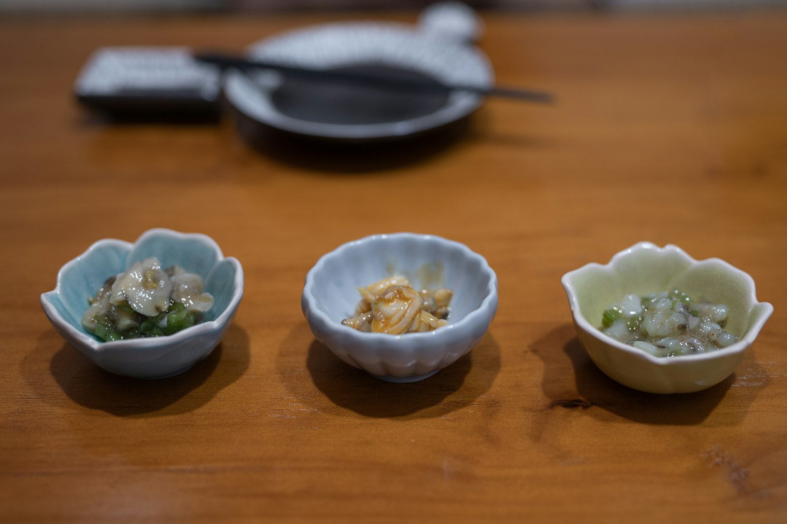 Small otoshi appetizer served at a Japanese izakaya, the table charge that replaces tipping
