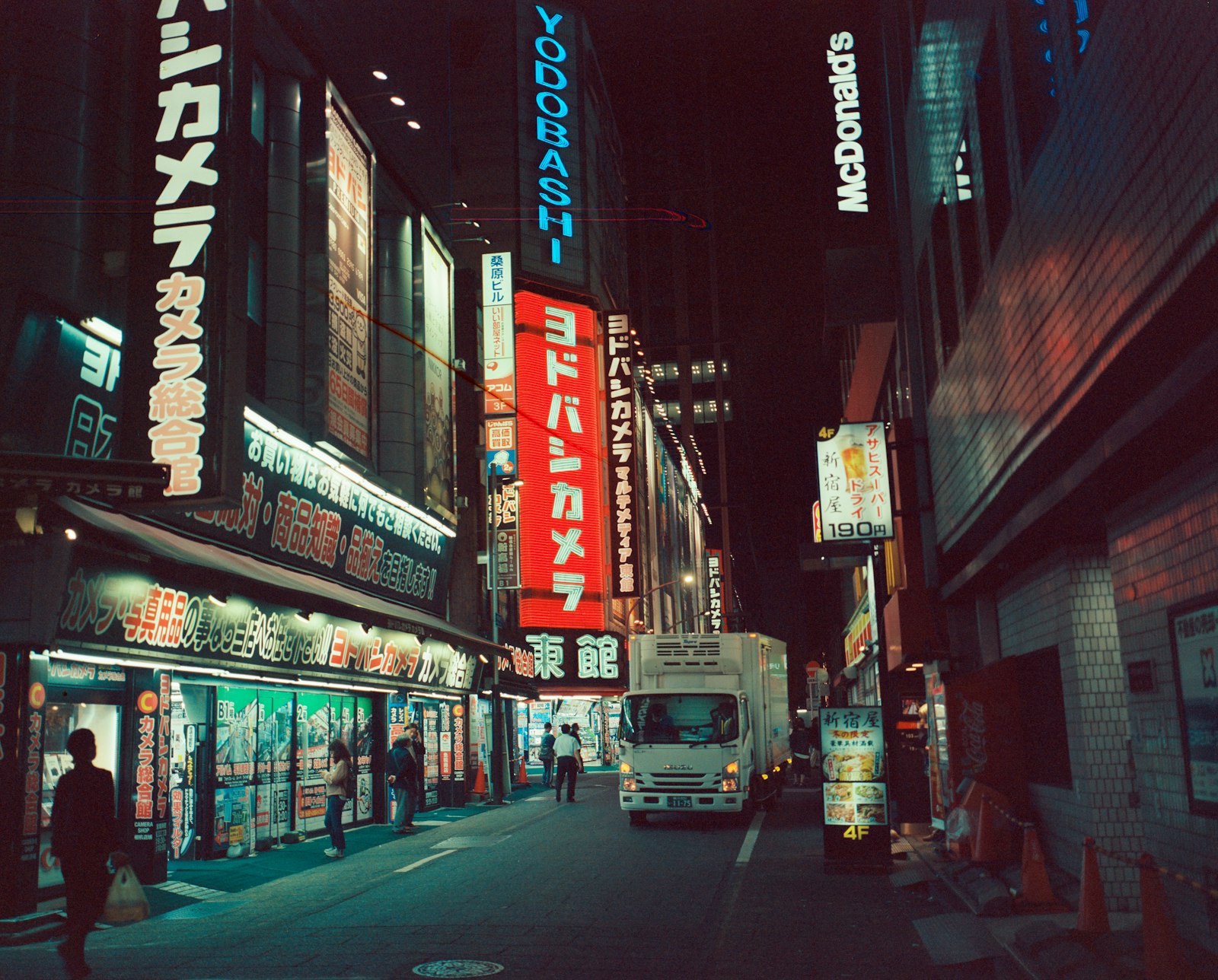 Neon signs over a Kabukicho street at night, the center of Tokyo's host club scene