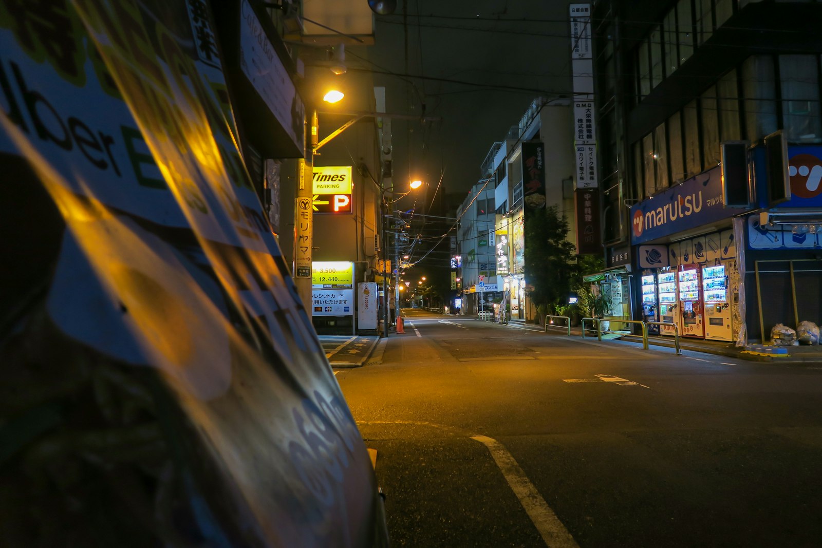 Neon signs above Akihabara's main street, the heart of Tokyo maid cafe culture