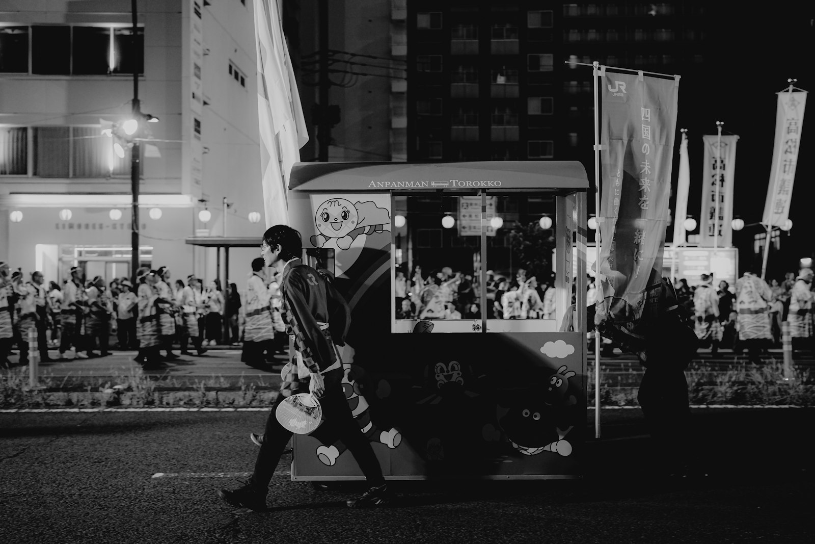 Awa Odori dancers performing in the street during a Tokyo summer night festival