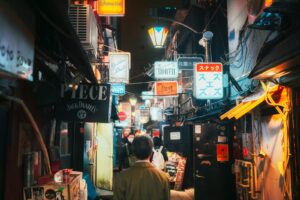 Neon-lit Shinjuku street at night, the usual starting point for a Tokyo private night tour