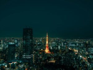 Tokyo Skytree lit up at night above the rooftops of Sumida