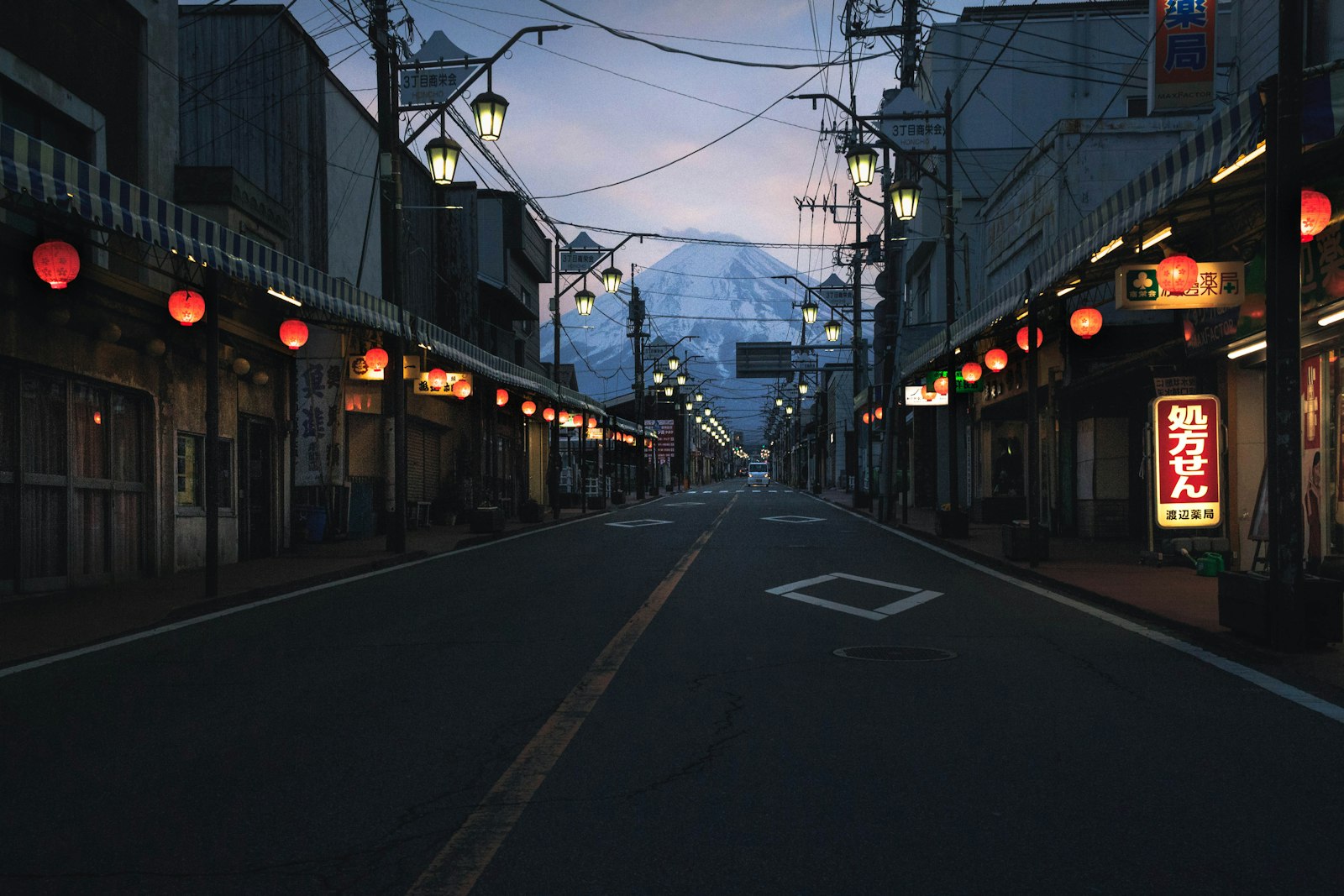 A narrow Shinjuku Sanchome street lined with small standing bars and lanterns