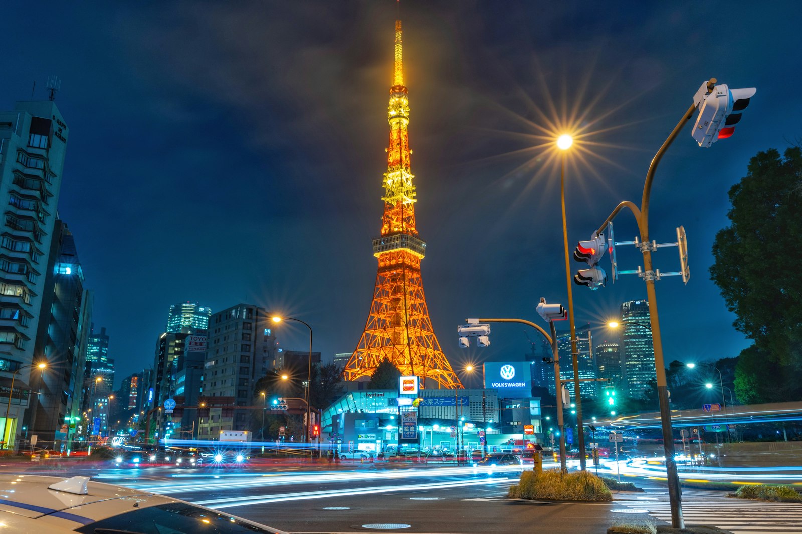 Zojoji Temple's main hall in front of Tokyo Tower lit up at night