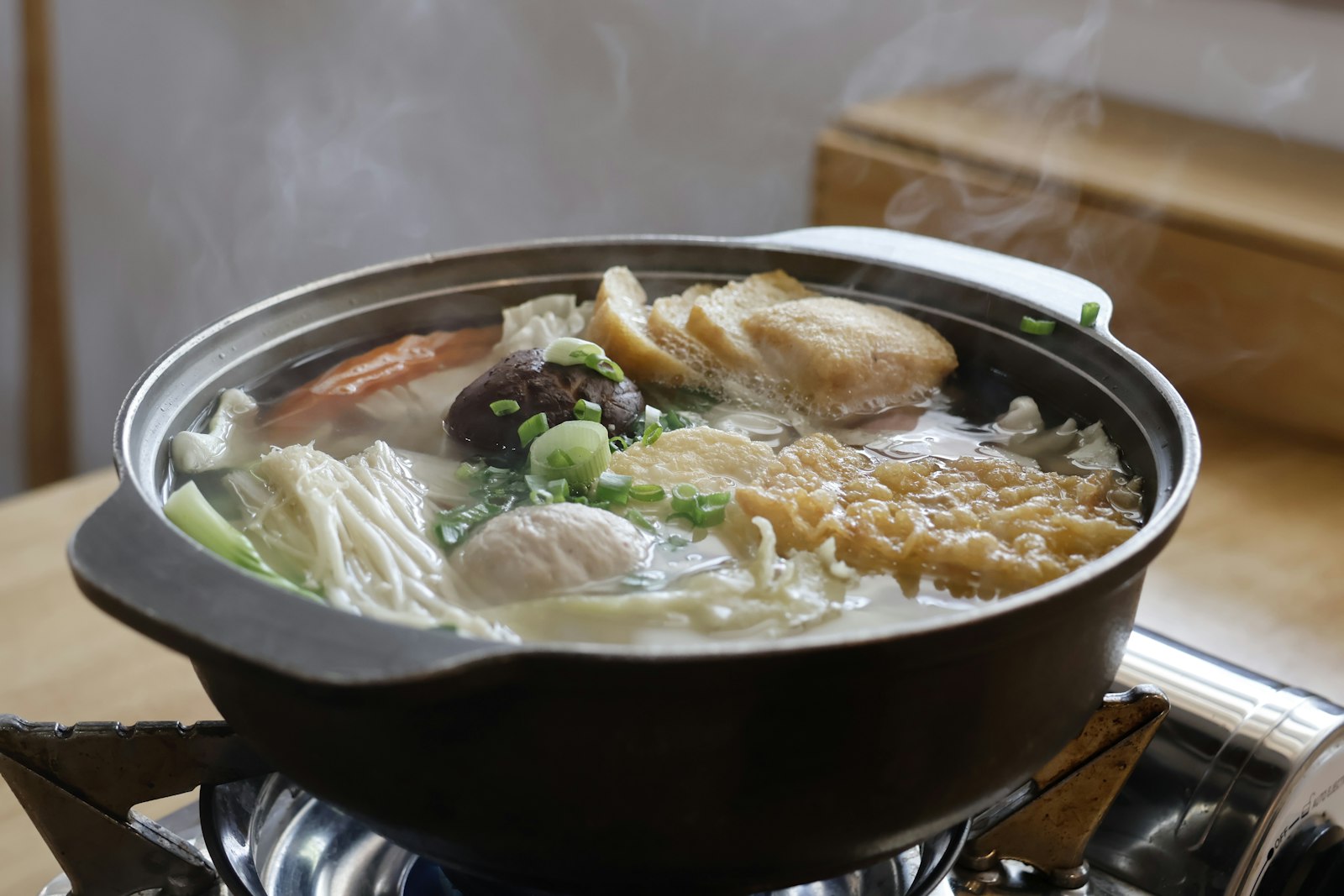 Sukiyaki hot pot with wagyu beef and a bowl of raw egg for dipping, a classic Japanese way to eat wagyu